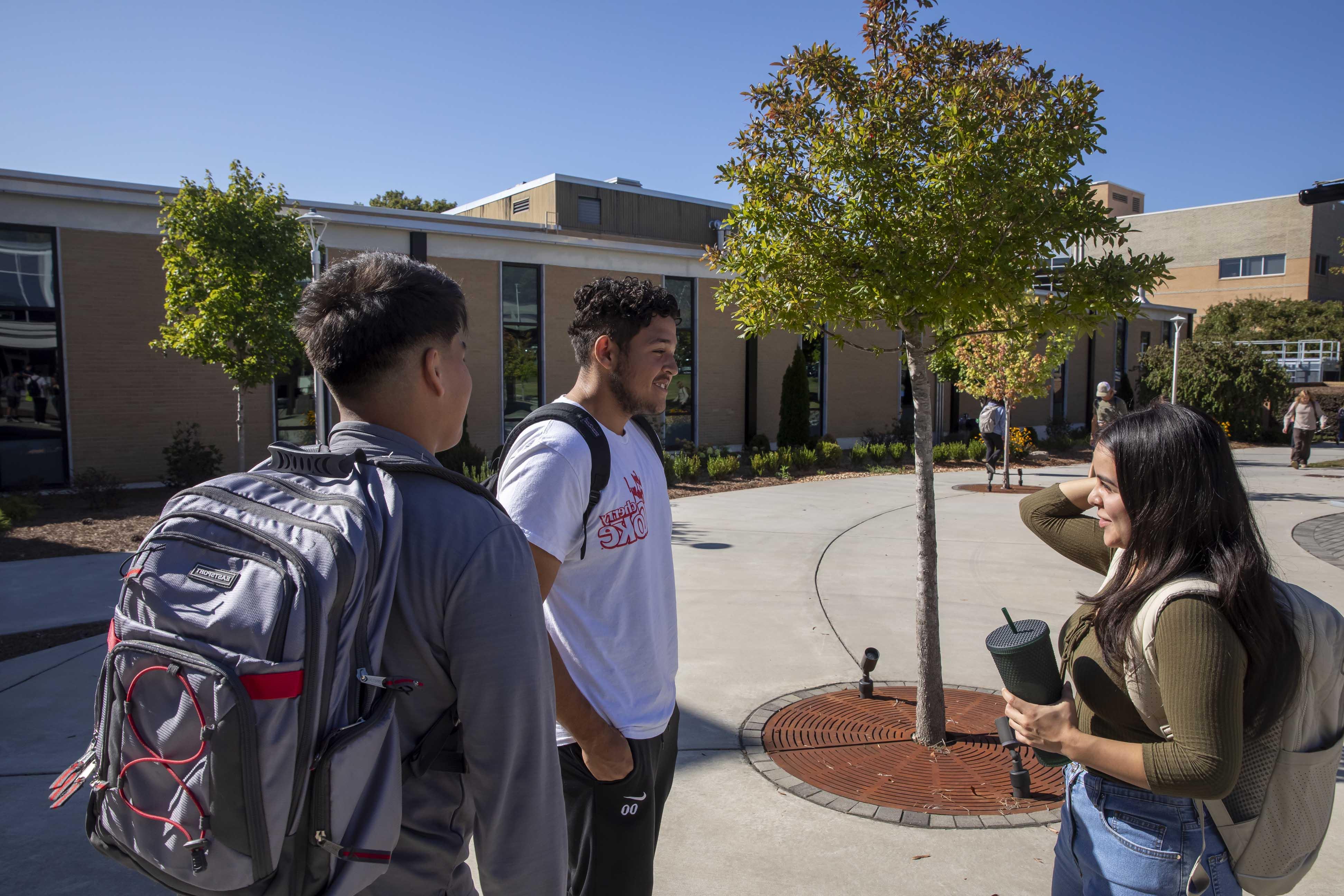 Students outside, talking in front of Dalton State building